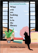 Book cover for What You Are Looking For Is in the Library by Michiko Aoyama, Cat looking out a window with a stack of books.